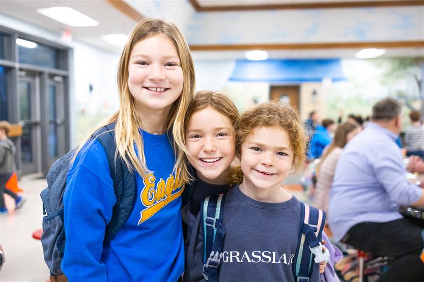 Students and their families enjoy donuts